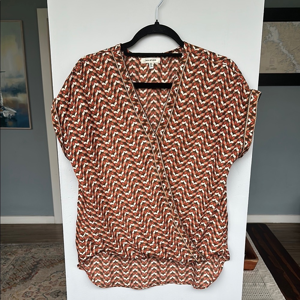 Orange and brown patterned blouse